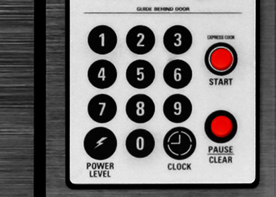 Microwave panel with raised bump dot stickers on Start and Pause buttons